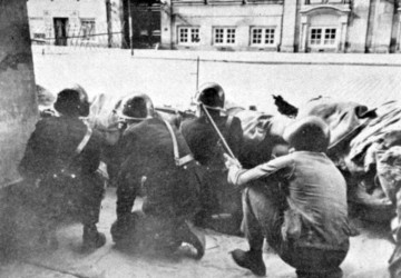 Danish police at Amalienborg, Copenhagen, crouching behind a sandbag barricade, firing on advancing German troops