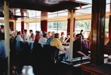 Guests enjoying a meal at Karen’s 80th birthday celebrations, May 2001