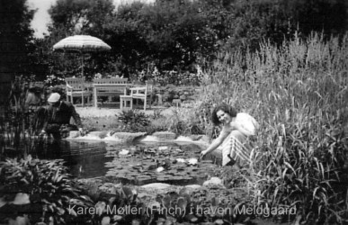 Karen by the lily pond at Meldgaard