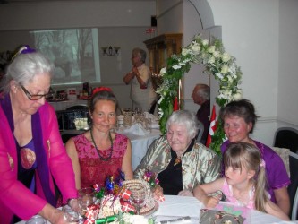 Karen’s sister Ruth distributes the kransekage at Karen’s 90th birthday celebrations